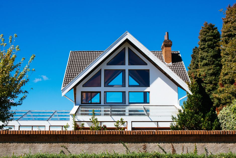 Modern home exterior with new large replacement windows
